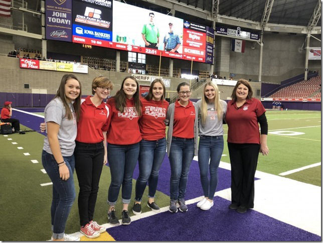 AHS Choir members sing National Anthem before football game